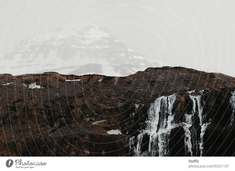 Waterfall with a mountain peak in the background in Iceland East Iceland Mountain summits Icelandic Icelandic nature Experiencing nature mountains Rock