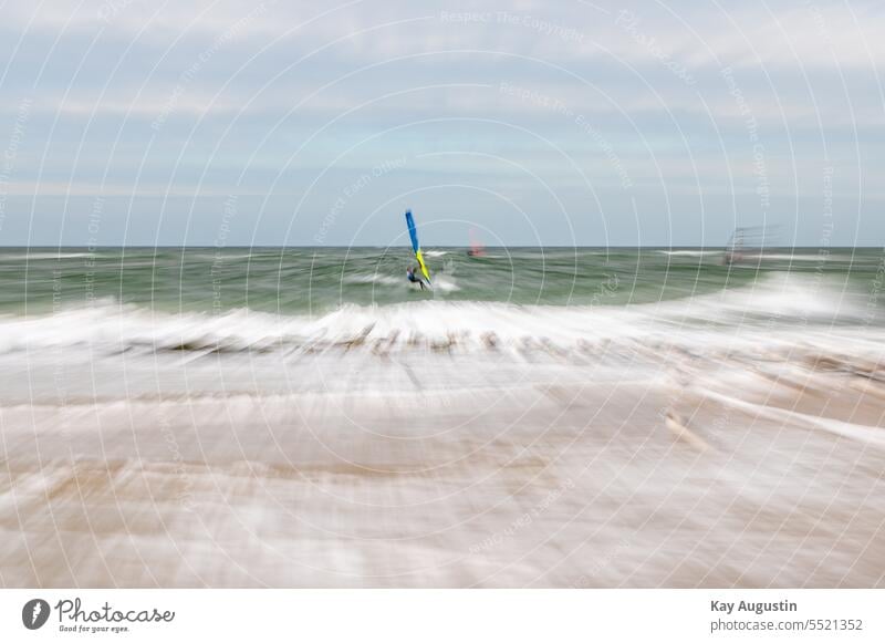 Zoom effect North Sea coast sailing stone groyne Surfer North Sea beach Experment Zomen Photography surf sails hazy Focal distance Sylt island gulls birds