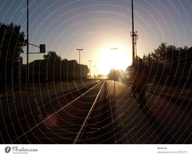 The way to work Sunrise Village Fog Commute Railroad tracks Railroad tie Sunbeam Dazzle Single-minded File case Calm Railroad station light Routine