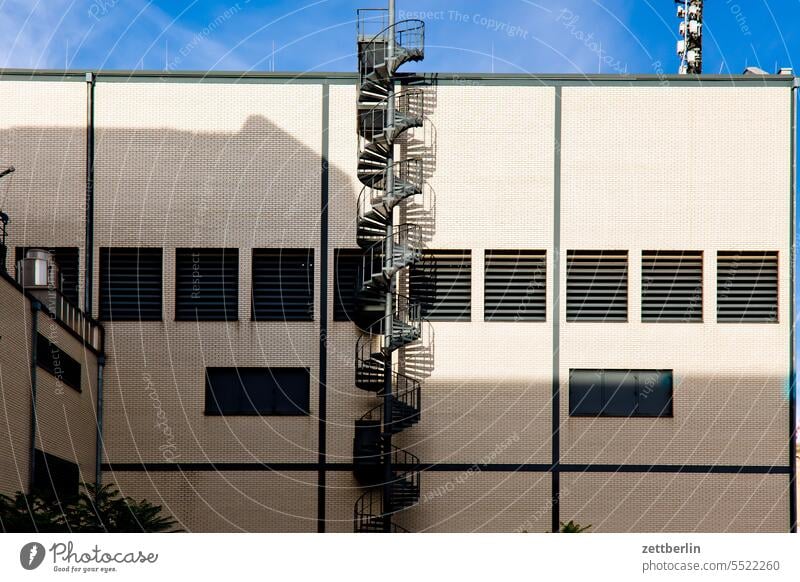 Building with spiral staircase Architecture Berlin Office city Germany Facade Window Worm's-eye view Capital city House (Residential Structure) Sky High-rise