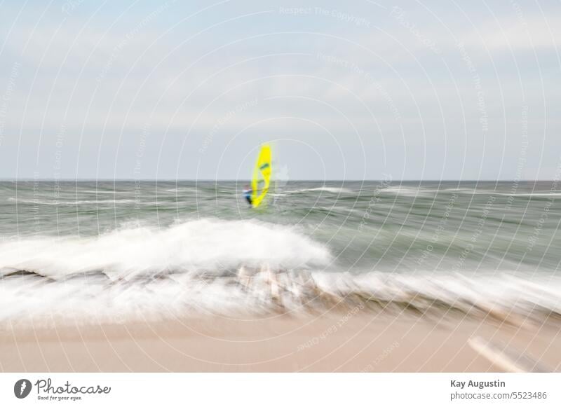 Zoom effect on beach North Sea coast sailing stone groyne Surfer North Sea beach Experment Zomen Photography surf sails hazy Focal distance Sylt island gulls