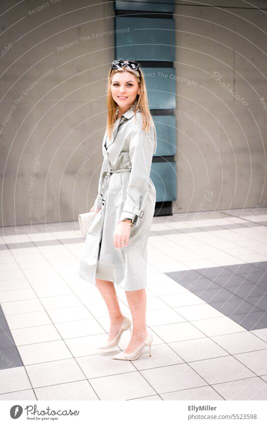 Portrait of young blonde woman at train station Woman portrait youthful Blonde feminine Attractive Face Emanation Self-confident Emotions Long-haired Authentic