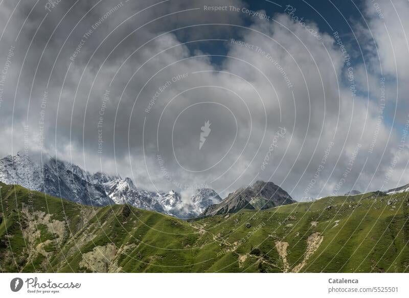 Mountain landscape with cloudy sky Beautiful weather Deserted Nature Day Rock Environment Snowcapped peak Sky mountains Peak Landscape Clouds Alps