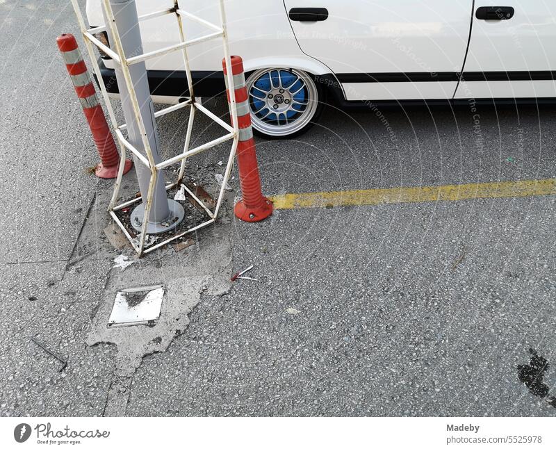 Lowered white Italian sedan of the eighties in the parking lot of a shopping center in the summer in Adapazari in the province of Sakarya in Turkey Fiat