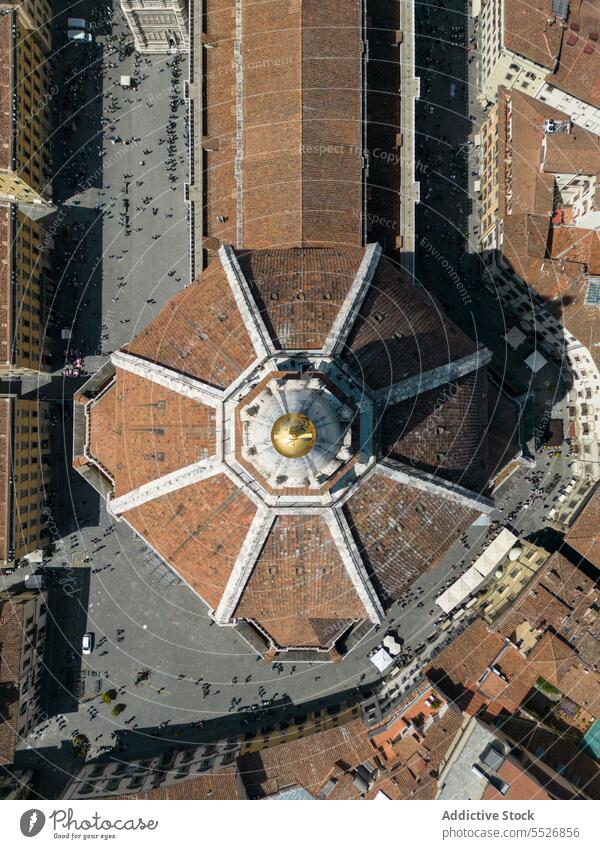 Drone view of cathedral church in city surrounded with houses dome building architecture cityscape historic town roof exterior tradition residential facade