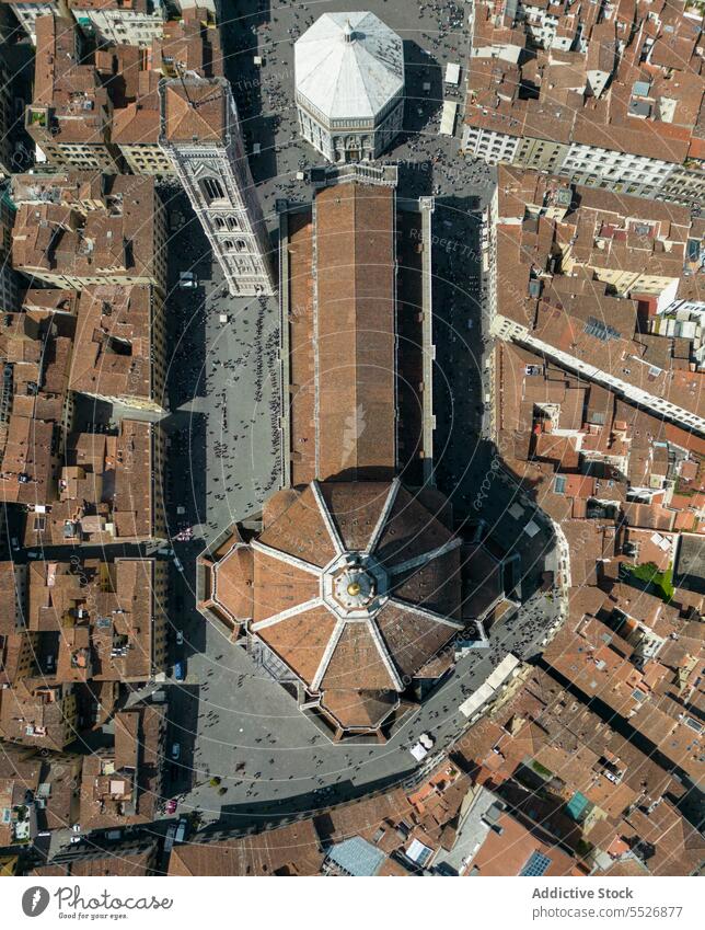 Drone view of cathedral church in city surrounded with houses dome building architecture cityscape historic town roof exterior tradition residential facade