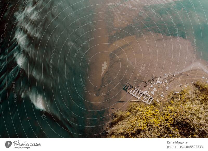 Aerial shot of flowing river with fragments of fallen bridge railing drowning accident aerial swimming falling nightmare falling down falling apart Dangerous