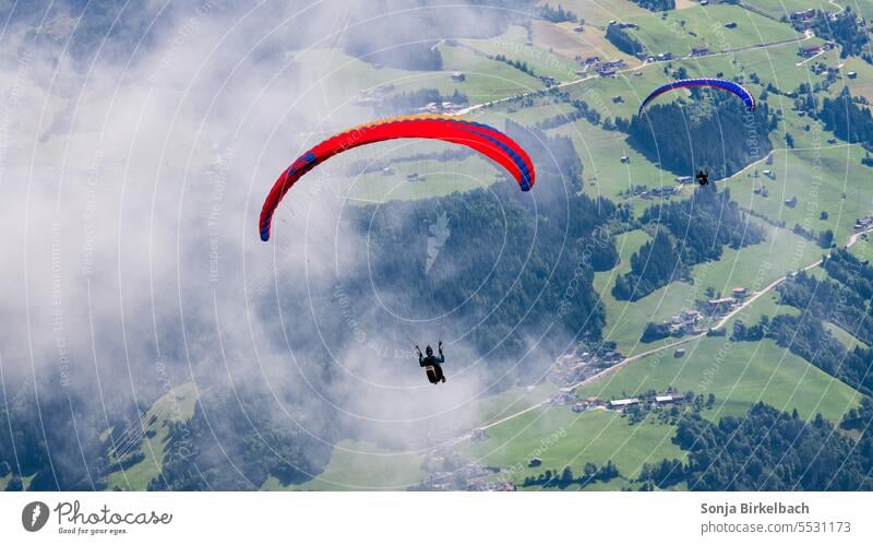 The world from above...paraglider approaching for landing Paraglining Bird's-eye view Meadow Exterior shot Aerial photograph Dark Colour photo Landscape Clouds