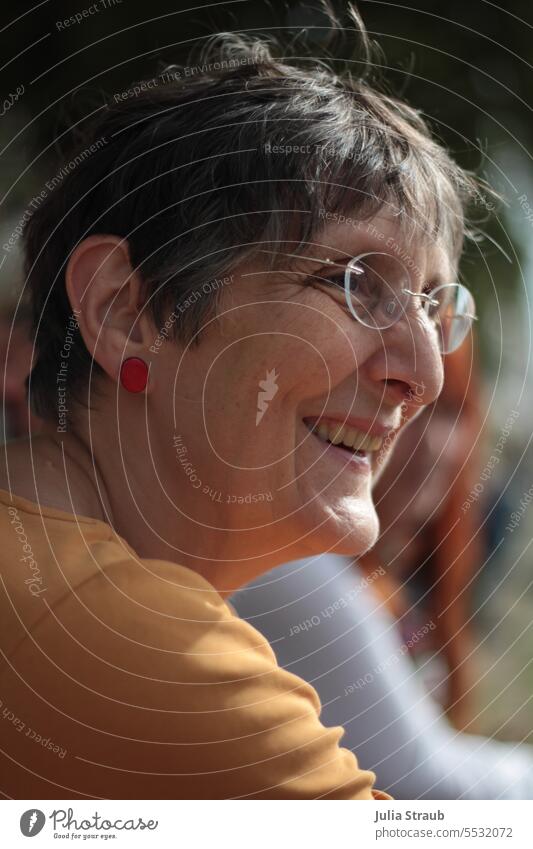 Wide land | Hearty laughter portrait Laughter Woman Eyeglasses short hair Yellow shirt Earring Light dark hair mustard yellow Joy fortunate