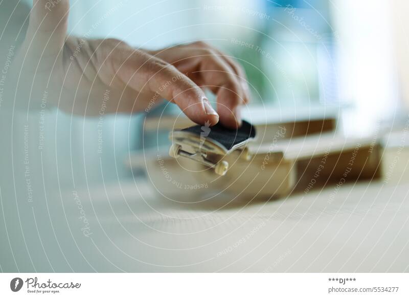 Fingerboard trick - jumping from the obstacle with fingers on the board in the air when landing. Fingers Figerboard Little finger Ring finger Wood fun skate