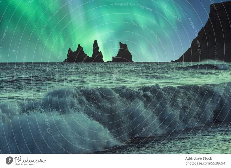 Amazing view of stormy sea and mountains against Aurora borealis sky aurora borealis reynisfjara vik nature northern lights landscape basalt stacks scenery