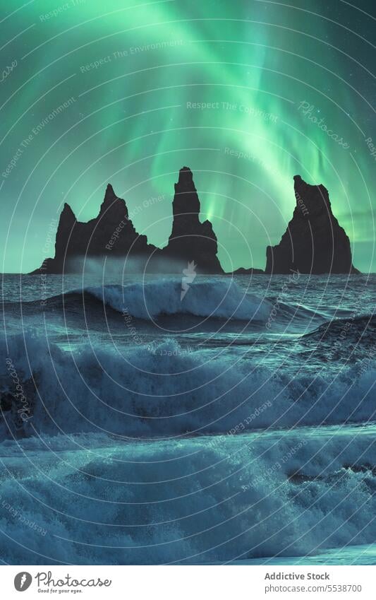 Amazing view of stormy sea and mountains against Aurora borealis sky aurora borealis reynisfjara vik nature northern lights landscape basalt stacks scenery