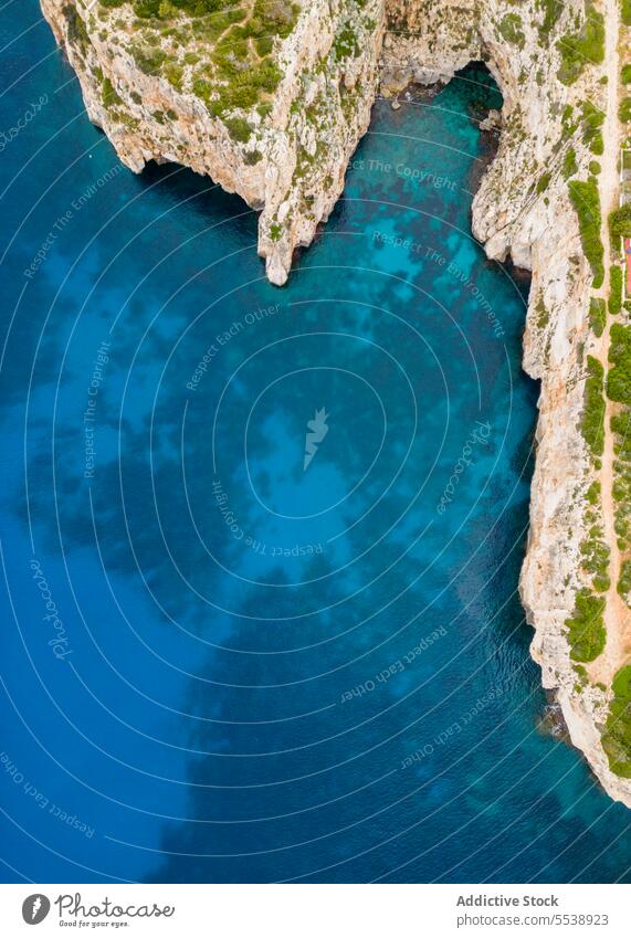 Bird eye view on shoreline with greenery island sea nature cliff picturesque coast seaside ocean seashore formation marine tropical remote seascape scenic