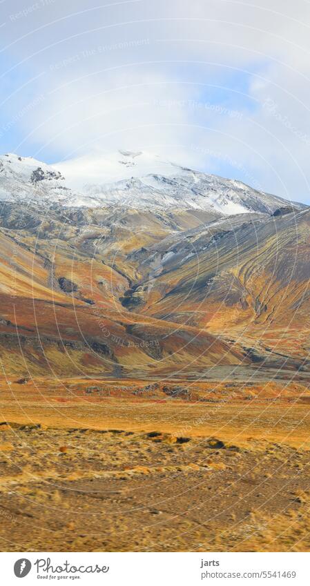 Iceland mountains colourful Play of colours Autumnal colours Volcano Valley Snowcapped peak Red Brown stunning Uniqueness Rock Lichen lichen blossom Sky Clouds