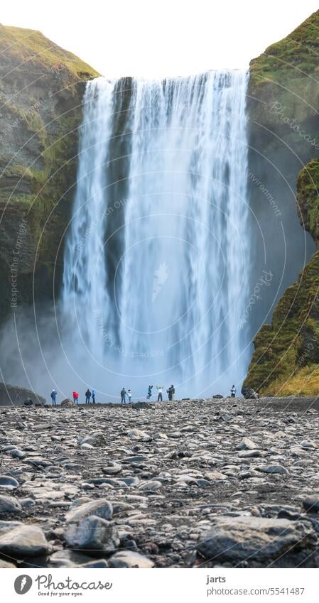 Funny people at the big waterfall Waterfall Tourists Tourist Attraction Moody fun Good mood Iceland Force Nature Landscape Elements naturally Wild Exterior shot