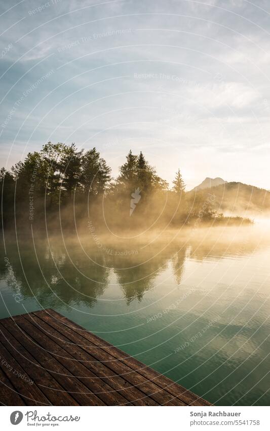 Sunrise at lake Fuschelsee in Austria Lake Fog Water fuschelsee Salzburg Morning Calm Dawn Nature Landscape Environment Exterior shot Sky Reflection Idyll