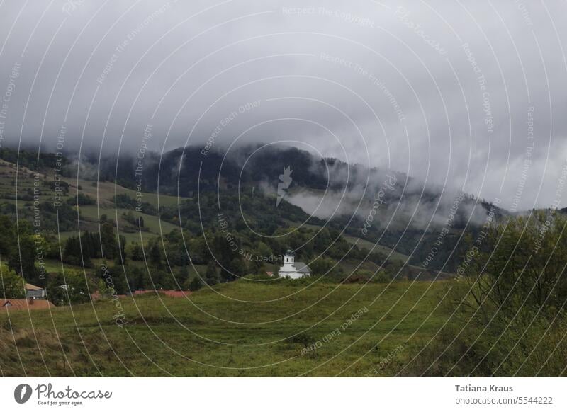 Church in clouds mountains Clouds cloudy Green duster Dark Rainy weather Landscape Sky Forest Grass somber Hill Storm