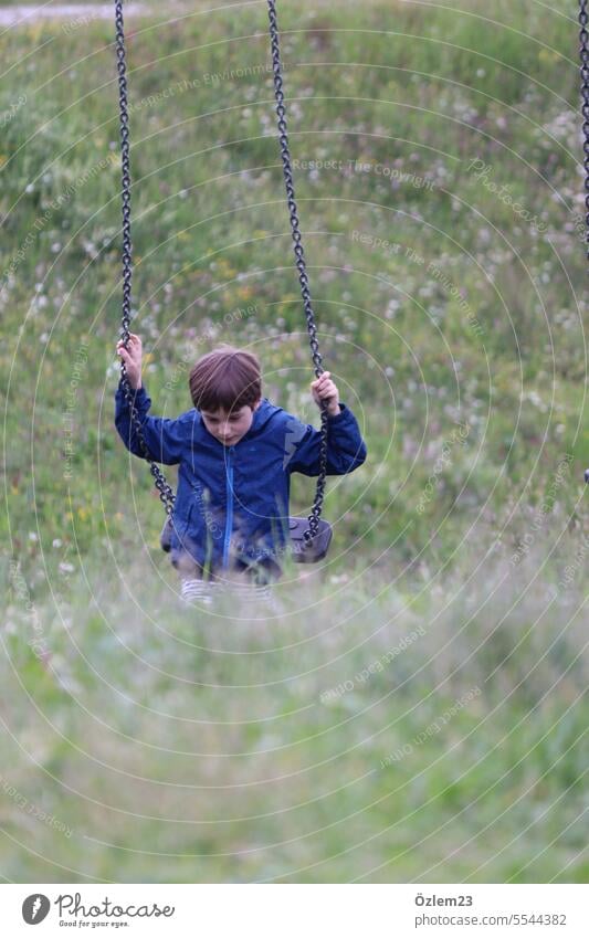 Child on the swing Swing To swing Infancy Nature Meadow Playground Joy Jokes Happy Summer