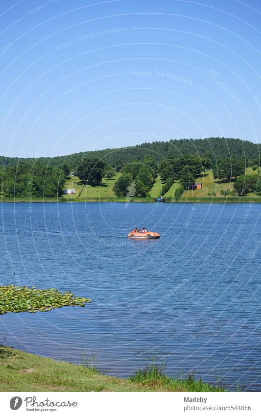 Pedal boat in front of blue sky in sunshine do the vacation on Poyrazlar lake in summer near Adapazari in Sakarya province in Turkey Lake gölü adapazari salarya