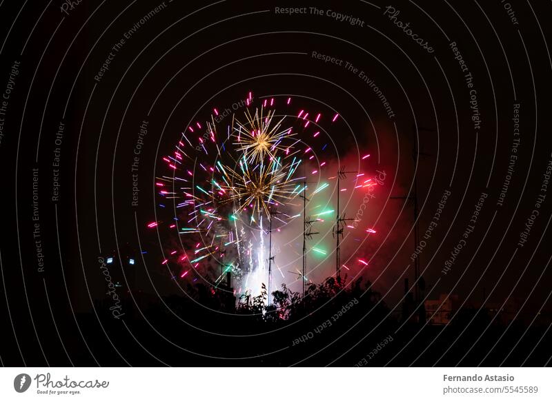 Fireworks. Colorful celebration fireworks isolated on a black sky background. From below, shot of wonderful and vivid fireworks exploding. Burst. colorful light