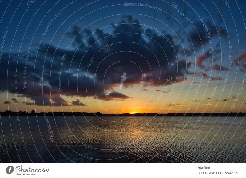 Sunrise over the Schlei, morning atmosphere with dramatic clouds Water Dawn reflection Clouds Horizon bank coast Blue Gray Orange Landscape Ocean Sunlight Light