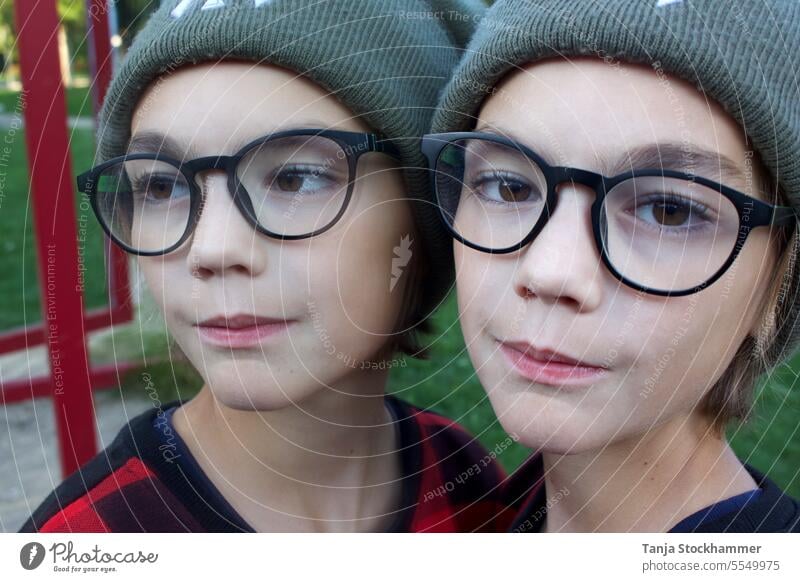 Child reflection in mirror Mirror image Reflections portrait portraits Head Person wearing glasses smilingly Smiling kind underage boy Mirror images brown eyes