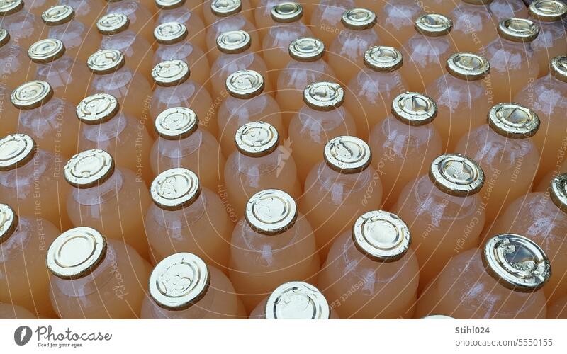 quite a lot of apple juice bottles - rain wet Apple juice Juice bottles Beverage Drinking Close-up Bottle Cold drink Food Thirst Refreshment Fluid Wet raindrops