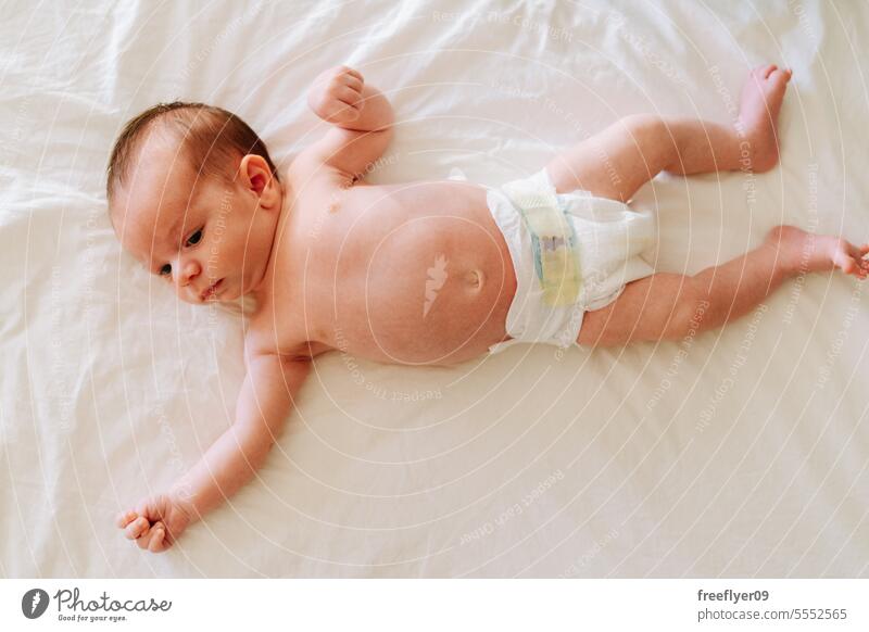 Portrait of a newborn with diapers from above baby sleeping together lying portrait copy space parenthood motherhood innocence life labor young boy happy small