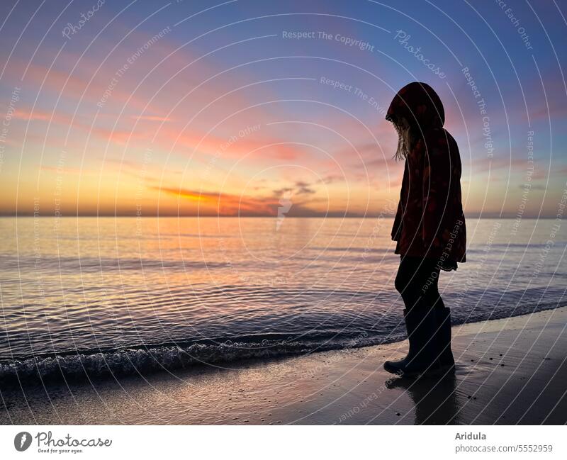 Child on beach at sunrise Sunrise Ocean Beach Baltic Sea Sand Sky Clouds Waves Morning in the morning coast Horizon Nature Landscape Sunlight Vacation & Travel