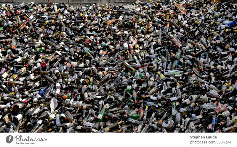 Old bottles of brown glass in a brown glass warehouse. They come from roadside glass containers called igloos. Some bottles are green because they were thrown into the wrong igloo.