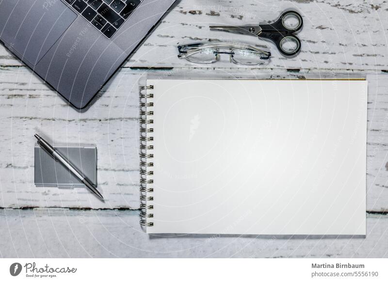 Top view on office desktop with labtop, glasses, pen and paper workplace coffee business keyboard table copy modern computer blank cup background notebook above