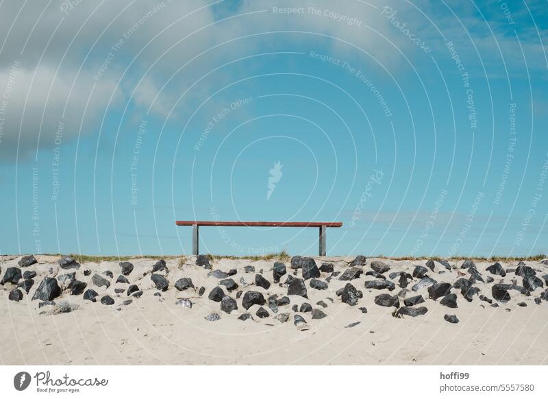 Bench on a stony, sandy embankment in front of a blue sky Dike Minimalistic minimalism Loneliness Calm Sky Deserted Nature Relaxation Sit Seating Wooden bench