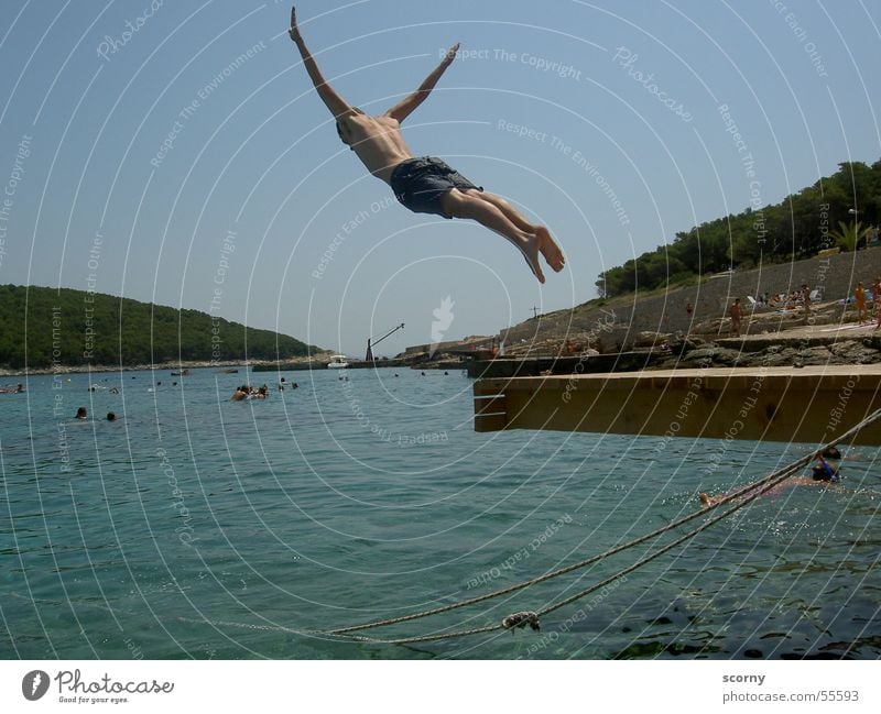 Gliding with water landing Ocean Jump Footbridge Leisure and hobbies Summer Springboard Croatia sea Water dive Island boy Joy fun leisure diving board