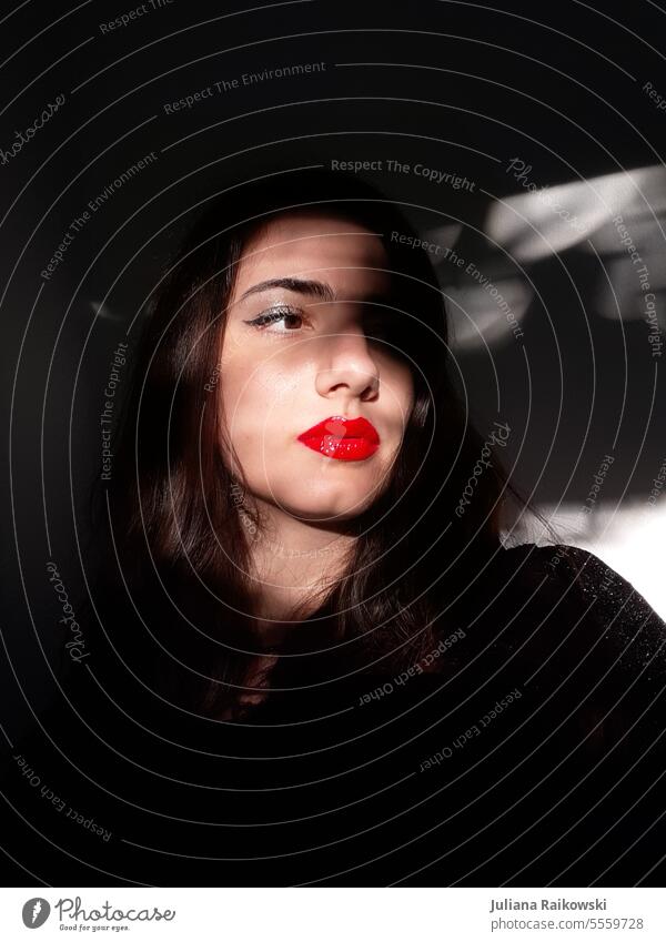 Shadow play on the face of a woman with red lipstick Model eyeliner Retro Lipgloss Hip & trendy Beauty Photography make-up Fashion Visual spectacle Light