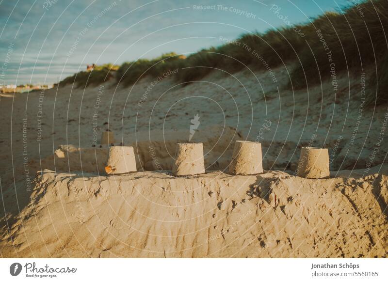 Sandcastle with four towers on the beach in Warnemünde Autumn Ocean Off-Season Baltic Sea travel Beach vacation Warnemuende Winter Vacation & Travel coast