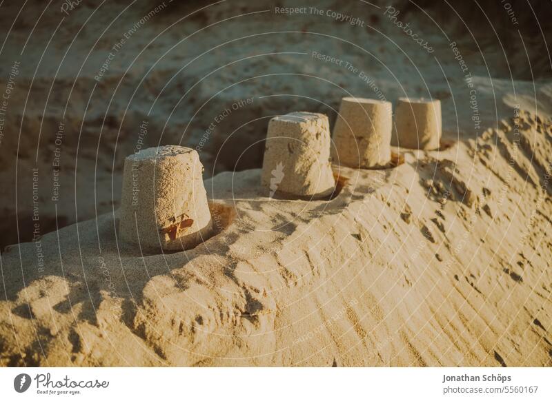 Sandcastle with four towers on the beach in Warnemünde Autumn Ocean Off-Season Baltic Sea travel Beach vacation Warnemuende Winter Vacation & Travel coast