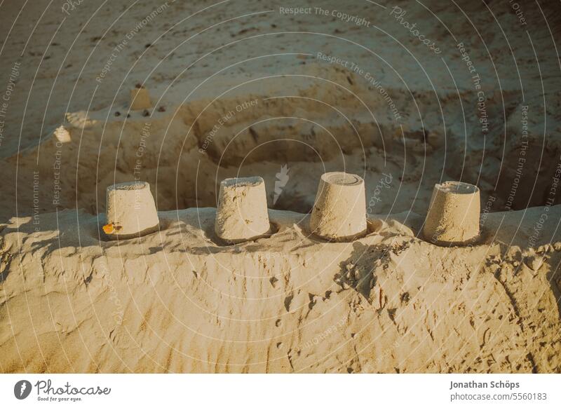 Sandcastle with four towers on the beach in Warnemünde Autumn Ocean Off-Season Baltic Sea travel Beach vacation Warnemuende Winter Vacation & Travel coast