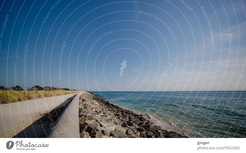 Beach promenade on the French Atlantic coast Ocean Water Promenade Boardwalks Wall (barrier) Rock Atlantic Ocean off grasses Bushes trees Sky Clouds Waves