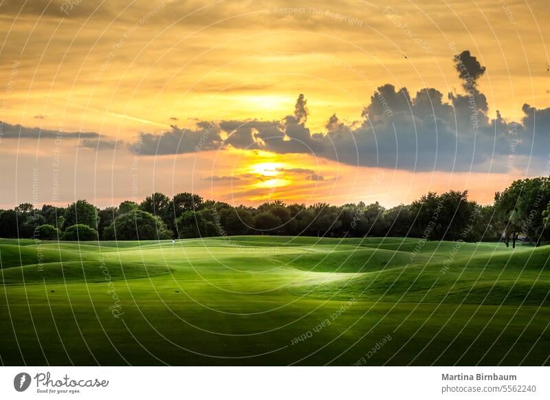 Sunset over a Texan golf course texas flag landscape sport field blue hole green sky sunny grass summer play sunset punta golfing tree palm republic outdoor