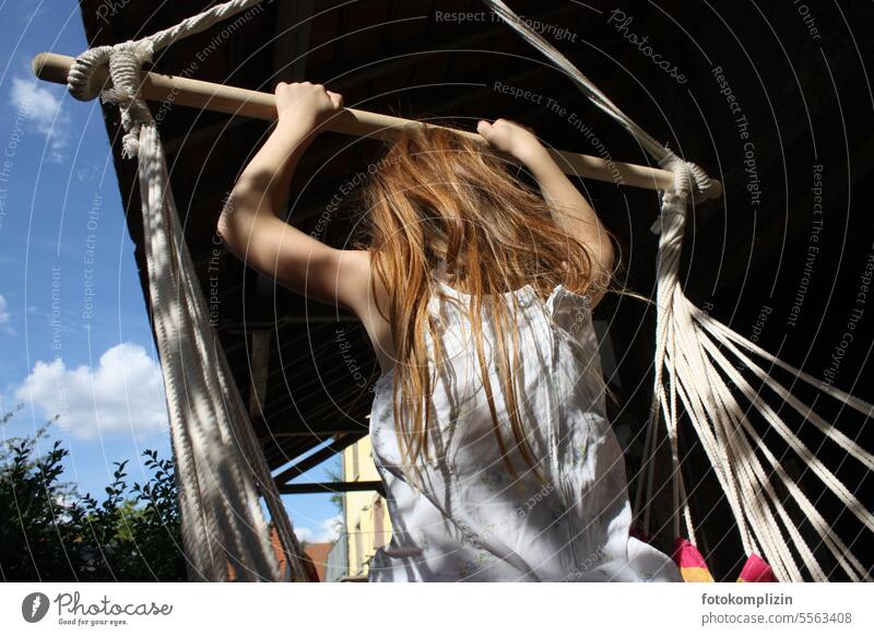 Back view of a red-haired child swinging Red-haired Child Girl Long-haired Infancy To swing Hammock hanging chairs fun Ease Joie de vivre (Vitality) Happiness