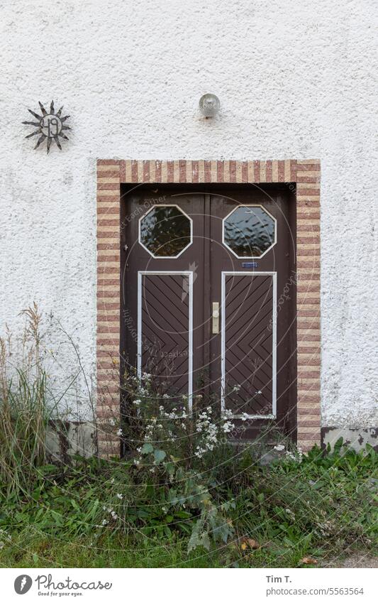 a forgotten entrance no. 49 Brandenburg door Village Autumn Closed House (Residential Structure) Empty Deserted Exterior shot Building Day Colour photo Facade