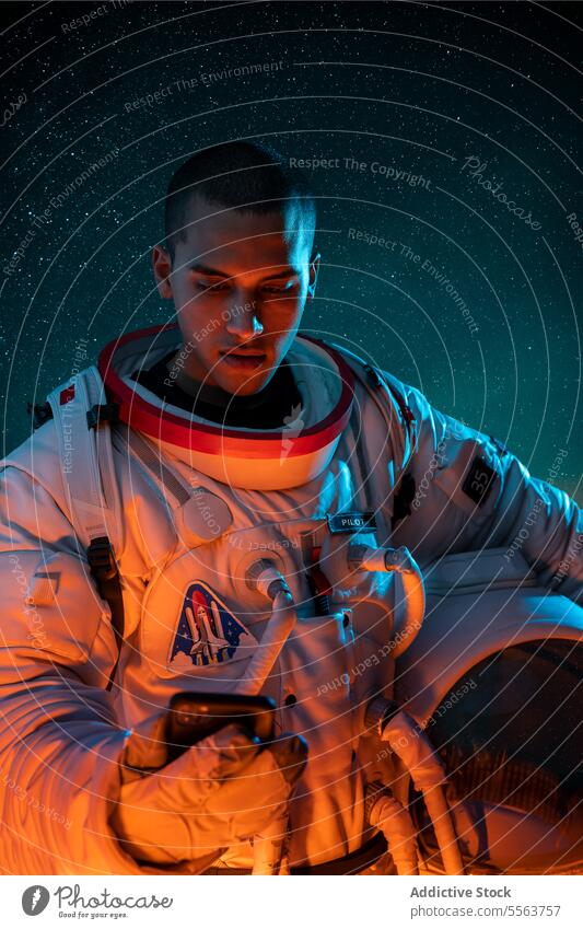 Astronaut in spacesuit holding helmet while browsing smartphone astronaut cosmonaut concept explore galaxy cosmos astronomy mission gadget planet character