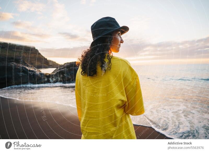 Pensive woman on beach sea pensive seashore ocean calm coast female sand wave nature wind water Tenerife Canary Islands seaside rest young Spain tranquil