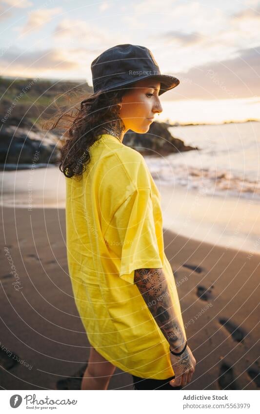 Pensive woman on beach sea pensive seashore ocean thoughtful calm coast female sand wave nature wind water Tenerife Canary Islands seaside rest young Spain