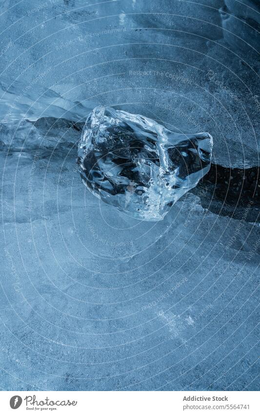 Close up of piece of ice frost cold water frozen glacier iceland seaside seashore north freeze beach nordic Jokulsarlon close up iceberg ice diamond crystal