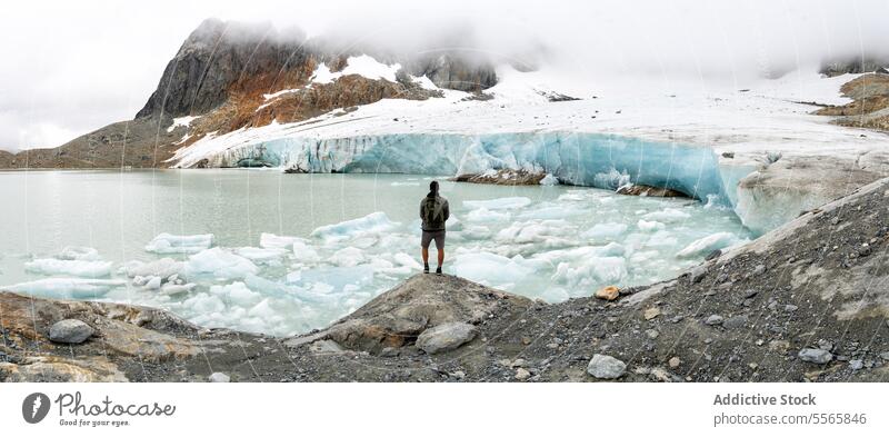 A person standing on a rock in front of a glacier Argentinian Patagonia adventure nature outdoor landscape mountains hiking exploration wilderness ice travel