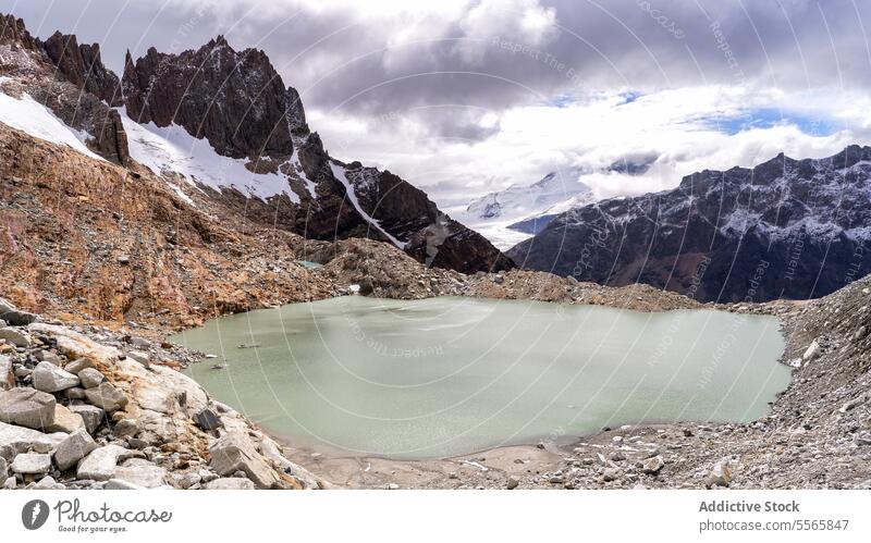 A mountain range with a body of water in front of it Patagonia Argentina landscape nature reflection serene majestic scenery outdoors wilderness glaciers hiking