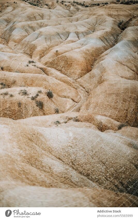 A large rock formation in the middle of a desert bardenas reales navarra arid mountain dry sand dunes landscape geology erosion stone nature wilderness barren