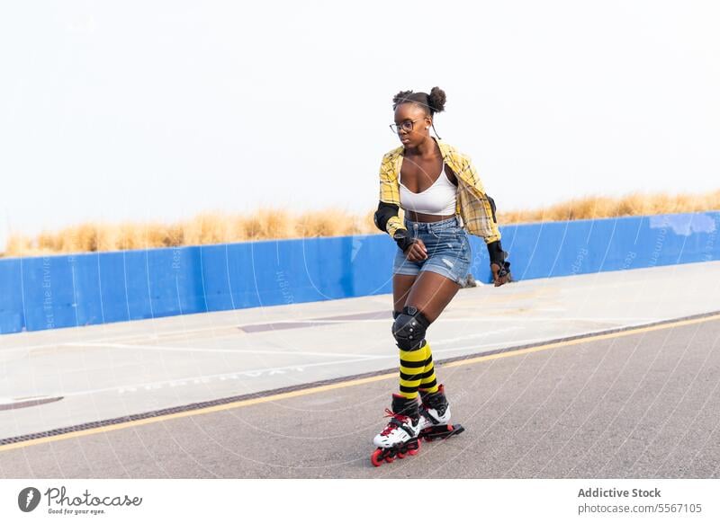 Woman Rollerskating On Rink At Skate Park Against Cloudless Sky Skating Casual Clear Sky Sport Practice Leisure Weekend Activity Summer Lifestyle Training