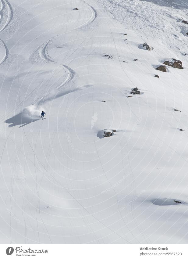 Snowboarder riding on slope of mountain during vacation unrecognizable snowboard person covering snowboarding warm suit swiss alps sport snowboarder lifestyle